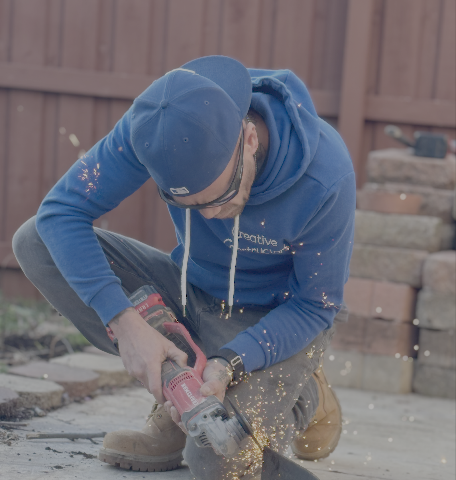 Jeremy McKinney cutting angle iron - professional craftsmanship at Creative Constructors